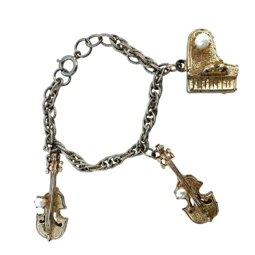 Vintage gold tone faux pearl instrument charm bracelet